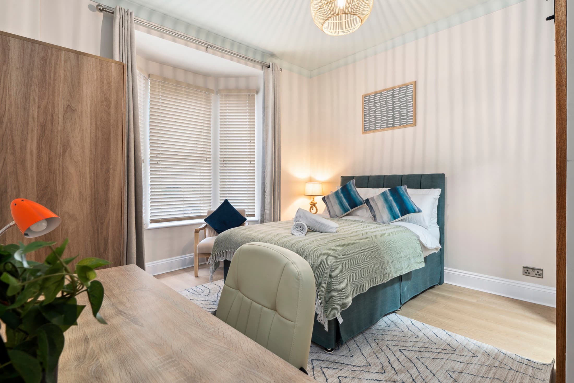 Well-furnished bedroom designed for studying and rest