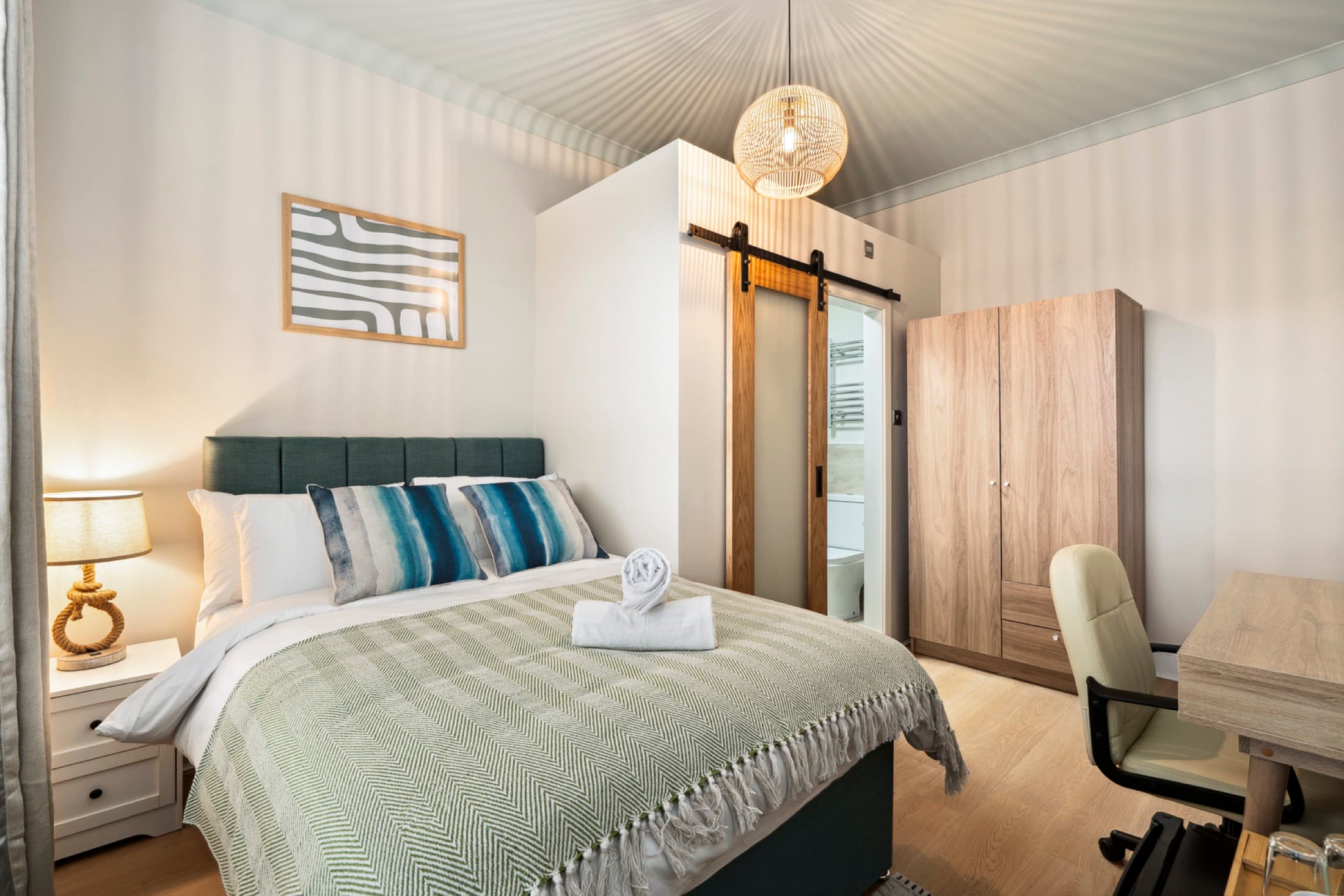 Shared lounge area with seating and natural daylight